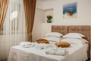Postel nebo postele na pokoji v ubytování Heritage Hotel Dea Hvar