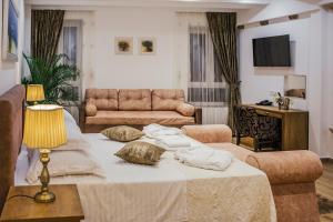 a living room filled with furniture and pillows at Heritage Hotel Dea Hvar in Hvar