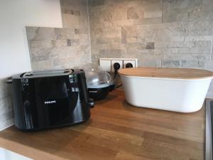 Eldhús eða eldhúskrókur á Apartment Hahnenkammblick