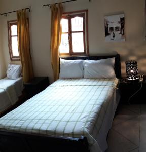 Säng eller sängar i ett rum på Ecolodge Espace Tamount