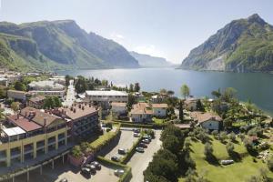 an aerial view of a town next to a lake at Park Hotel Abbadia in Abbadia Lariana
