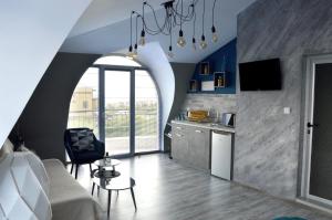 a living room with an archway in the middle of a room at Boutique Villa Amalia in Chernomorets