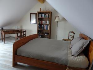 Postel nebo postele na pokoji v ubytování Le Noyer