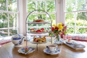 a table with a plate of food on a shelf at Tickton Grange Hotel in Beverley