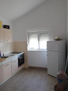 Kuchyň nebo kuchyňský kout v ubytování Apartment Dario