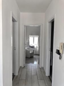 a white room with a white couch and a mirror at Sky House Amalfi Coast in Scala +36 photos