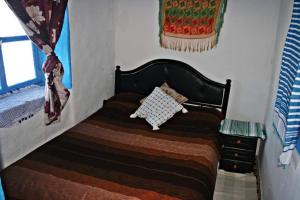 Postel nebo postele na pokoji v ubytování Nefzi Guest House