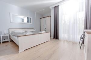 Postel nebo postele na pokoji v ubytování Resort Apartamenty Klifowa Rewal 21 + 34 fotografií