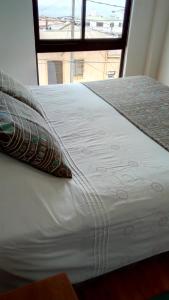 Rúm í herbergi á B&B Hostel CasaMoro
