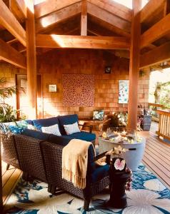 a living room with a couch and a table at At the Craters Edge in Volcano