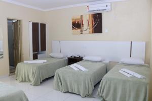 Postel nebo postele na pokoji v ubytování Hotel Capuchins