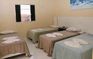 Postel nebo postele na pokoji v ubytování Hotel Capuchins