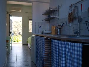 a kitchen with a sink and a counter top at Ikion Studios in Steni Vala Alonissos