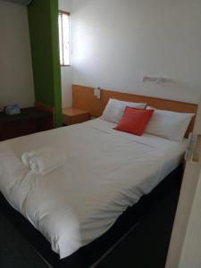 Postel nebo postele na pokoji v ubytování Annerley Motor Inn