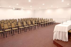 a large room with rows of chairs and tables at CHA Prime Curitiba in Curitiba
