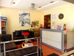 a waiting room with a couch and a table at Abrhys Ridge Inn in Coron