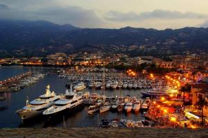 a group of boats docked in a harbor at night at Grand Hôtel De Calvi in Calvi