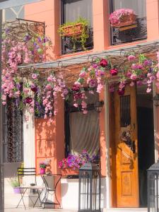 a house with flowers on the front of it at Sweet Home Hotel in Athens