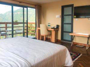 Ένα ή περισσότερα κρεβάτια σε δωμάτιο στο Belgian Hotel Pvt. Ltd +31 φωτογραφίες