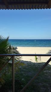 a view of the beach from a balcony at juara seaview chalet, kampung juara in Kampong Juara