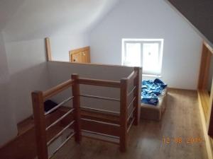 a small room with a bunk bed and a staircase at Apartament Jastarnia ul Bałtycka 26 in Jastarnia