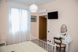 TV a/nebo společenská místnost v ubytování Relais d 'Itria