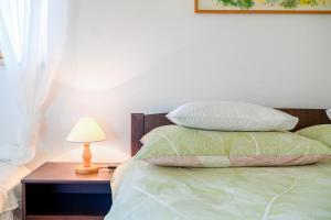 Postel nebo postele na pokoji v ubytování Apartman Skroza