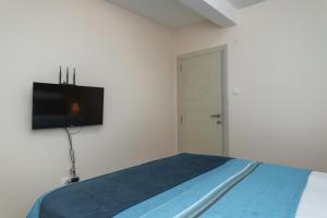 TV i/ili multimedijalni sistem u objektu Apartmani Tref