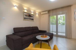 Prostor za sedenje u objektu Apartmani Tref