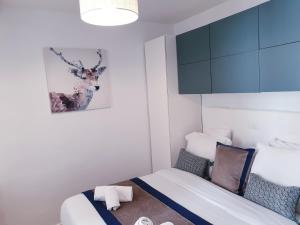a bedroom with a bed and a blue cabinet at Apartment Quartier Latin - Mouffetard in Paris