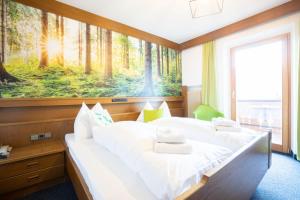 Postel nebo postele na pokoji v ubytování Guesthouse Pension Grafenstein