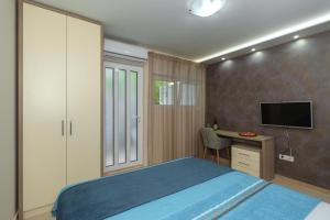 Krevet ili kreveti u jedinici u okviru objekta Apartmani Tref