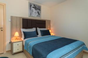 Krevet ili kreveti u jedinici u okviru objekta Apartmani Tref