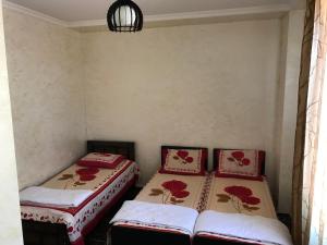 Postel nebo postele na pokoji v ubytování Kobuleti Guest House chexov 24