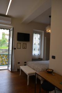 Televízia a/alebo spoločenská miestnosť v ubytovaní ilGirasole b&b