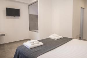 Posteľ alebo postele v izbe v ubytovaní SuitesGaribaldi