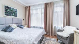 Postel nebo postele na pokoji v ubytování Parus Boutique Hotel
