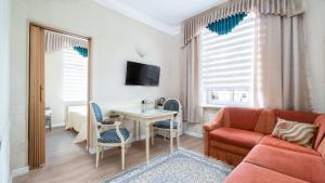 TV a/nebo společenská místnost v ubytování Parus Boutique Hotel