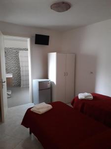 A bed or beds in a room at b&b nonna silvia