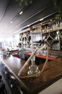 a wooden bar with a rope on top of it at Cle Beach Boutique Hotel in Marmaris