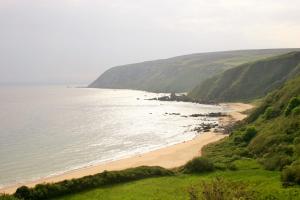 a view of a beach with the ocean at Wild Atlantic View Inishowen in Greencastle