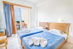 Posteľ alebo postele v izbe v ubytovaní Alonia Hotel Apartments