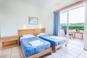 Posteľ alebo postele v izbe v ubytovaní Alonia Hotel Apartments