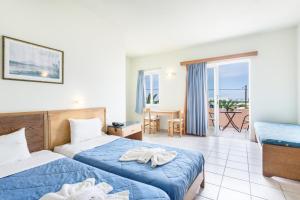 Posteľ alebo postele v izbe v ubytovaní Alonia Hotel Apartments