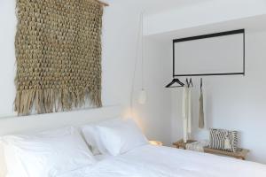 Posteľ alebo postele v izbe v ubytovaní Amantes Villas and Suites
