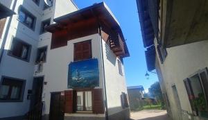 a building with a painting on the side of it at Casa Beatrice in Aprica