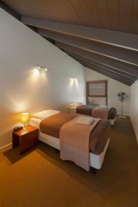 Southern Ocean Villas tesisinde bir odada yatak veya yataklar