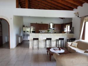 a living room with a couch and a table at Lasa Valley Villa in Lasa