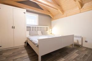 Postel nebo postele na pokoji v ubytování Apartmány MALIK