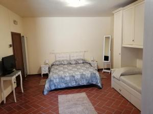 Posteľ alebo postele v izbe v ubytovaní La Casa del Gigli